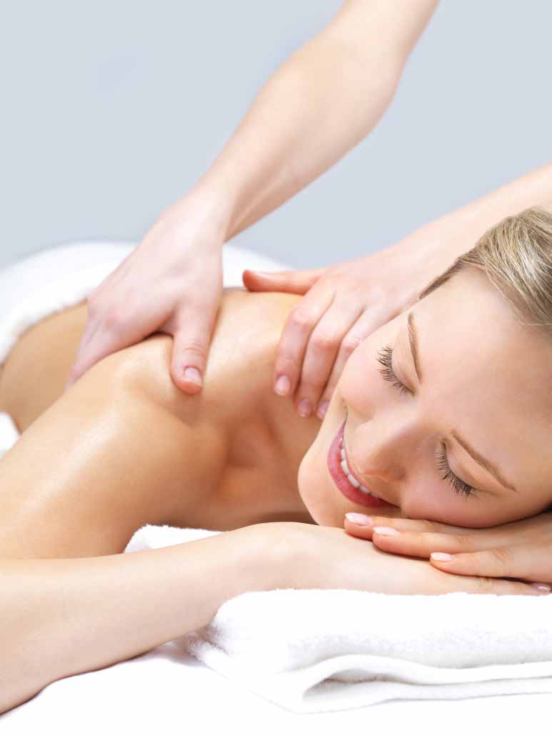 Receiving massage therapy by a registered massage therapist at evolve Massage & Wellness in Hamilton.